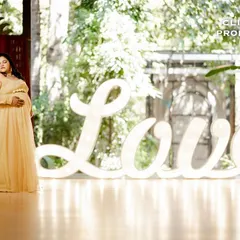 This large, illuminated "Love" sign is a fantastic prop for indoor or covered spaces. It adds a bold, romantic statement and beautiful soft lighting to your photos.