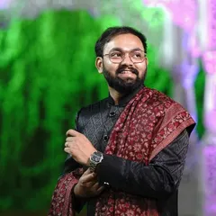 This black Jodhpuri suit with a self-design pattern is paired with a beautiful red printed shawl for a royal look. It’s a complete set available for rent for your next big family wedding.
