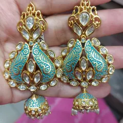 The same stunning real Polki earrings, this time with aqua blue meenakari work. I have multiple color options to match your chosen outfit perfectly.