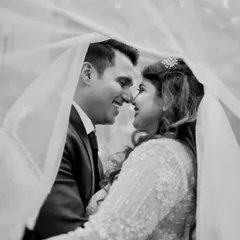 A timeless black and white portrait. This classic shot under the veil captures the intimacy and romance of a Catholic wedding, showing our ability to create artistic and elegant images.