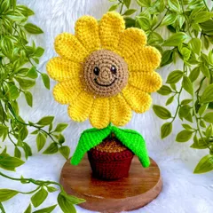 Meet my little smiling sunflower pot. This cheerful fellow is perfect for a desk or a shelf, bringing a bit of sunshine indoors. It’s one of my most popular desk decor items, and I just love the happy face on it.