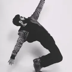 A classic dance pose captured in black and white. For me, dance is a form of magic, a way to make music visible.