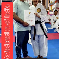 Awarding a certificate for the 'Gorin no Kata' to a dedicated student. This recognizes her mastery of a specific, advanced form, showcasing the depth of our curriculum.