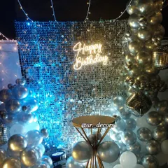 The cool blue lighting on the shimmer wall creates a fantastic nighttime party atmosphere on the rooftop.