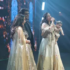 Here I am, a proud working mom, hosting a large sangeet ceremony with my daughter Gauri in one arm and the microphone in the other. This moment captures my core belief: women can balance their professional passions and motherhood. I help brands connect with this empowered audience.