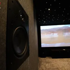 Another detailed shot of an in-wall speaker, showing how it sits flush with the wall for a clean, professional look while delivering powerful sound.