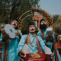 Entertainment with a side of snacks. We hired these fun "chana jor garam" performers who entertained guests with their folk artistry while serving up a classic Indian nibble during the Haldi ceremony.