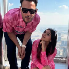 A fun moment with my husband at the top of the Burj Khalifa. My pink Myntra dress and his matching pink shirt were a great example of couple-coordinated outfits for a vacation.