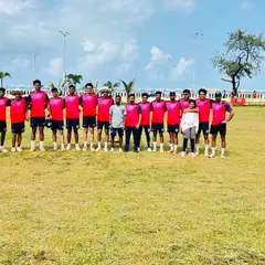 Our team in pink jerseys lines up on the field before a Kanga League match, ready for the day's competition.