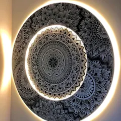 Another view of the backlit mandala, showing how the light interacts with the layered design. This piece is both an artwork and a custom light fixture.