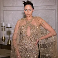 A perfect bridesmaid look for a sangeet or cocktail party. This stunning gold embellished gown by Amit GT is the ideal blend of elegance and glamour, ensuring you shine without outshining the bride.