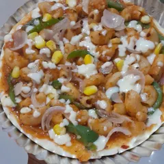 A unique Macaroni Pizza, combining two favorites into one delicious dish. This is a very popular item, especially for kids' parties.