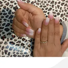 A side view of the ombre nail extensions, highlighting the structure and shape of the nails. This classic design remains one of our most requested services for its sheer elegance.