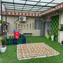 This project shows a complete terrace transformation into a child-friendly play zone. We used artificial turf for safety and durability, and added wall-mounted planters and a checkerboard green wall to make the space vibrant and fun.