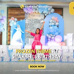 A happy birthday girl celebrates her tenth birthday with a spectacular Frozen theme, featuring a life-sized Elsa cutout, shimmering backdrops, and her name in giant marquee letters.