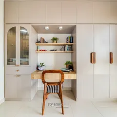 When you need to create multiple functions in a small room, using one wall is a great solution. Here, we designed a single unit that incorporates wardrobes, a study desk, and a mandir, creating a look that is both functional and aesthetically neat.