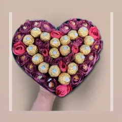 The perfect union of romance and indulgence. This heart-shaped box features a beautiful arrangement of deep pink roses and golden Ferrero Rocher chocolates, making it an unforgettable gift for someone special.