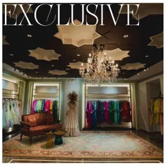The exclusive bridal section for 'Eclat by Batukbhai', where we created a dramatic and intimate atmosphere. The star-patterned ceiling and a classic crystal chandelier provide a luxurious canopy for the vibrant couture collections on display.