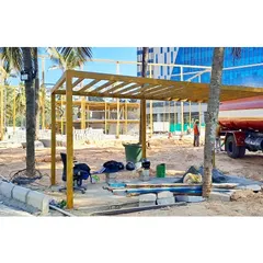 A pergola structure being fabricated on-site at Vaishnavi Tech Park. We oversee the construction of all landscape elements to ensure quality and adherence to our design.