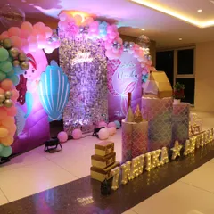 A magical mermaid-themed birthday decoration for Anvika. This setup includes a sparkling sequin wall, custom mermaid backdrops, themed cutouts, and a colorful balloon arch to create an underwater fantasy world.