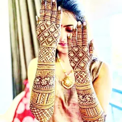 This striking design uses a bold, geometric checkerboard pattern that covers the entire hand and extends up the arm. It's a contemporary and eye-catching choice for a bride who wants to make a statement.
