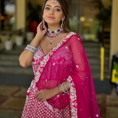 A vision in pink for a sangeet or reception. This soft-glam look combines a romantic pink palette with glowing skin and beautifully highlighted features, ensuring you look and feel like the star of the evening.