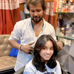 A fresh, modern layered haircut with face-framing bangs. This style is great for adding shape and is easy to manage for a chic, everyday look.