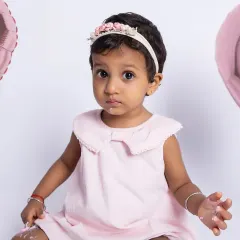 A close-up of our little princess after her first taste of birthday cake. The little bit of frosting on her face is just the cutest detail.
