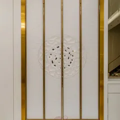 The mandir doors closed, showcasing the intricate, custom-designed 3D pattern on the exterior. The design is both a beautiful decorative element and a respectful enclosure for the sacred space within.