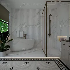 A luxurious master bathroom in Mansarovar Garden, featuring a freestanding bathtub, a separate glass-enclosed shower, and classic black-and-white patterned floor tiles. The large window and indoor plant add a touch of nature.