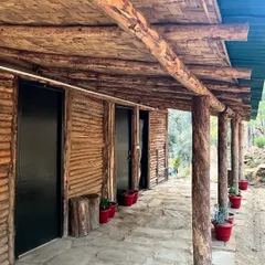 The exterior of Rakesh's hand-built camp, made with local wood and materials. It's a place to connect with nature after a long day of riding.