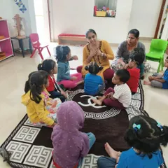 A quiet moment of circle time. This is where we come together as a community to share stories, sing songs, and practice grace and courtesy. Every voice matters here.