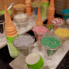 What's a party without ice cream? We can set up a DIY ice cream cone station with a colorful assortment of sprinkles and toppings, a guaranteed hit with the kids.
