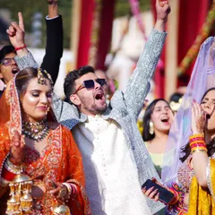 The energy of a baraat is infectious! I focus on capturing that raw, unfiltered joy, like this shot of the groom and his friends celebrating with full enthusiasm. These are the candid moments that truly define the celebration.