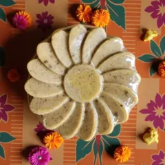 A close-up of the Abhyangasnan Ubtan Soap. The texture comes from the hand-pounded ubtan, which provides gentle exfoliation to reveal glowing skin.