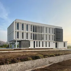 The hostel is designed to be a safe, comfortable, and resilient environment for students. The clean, modern facade sits comfortably in the rural landscape, providing a sense of belonging and promoting physical well being.