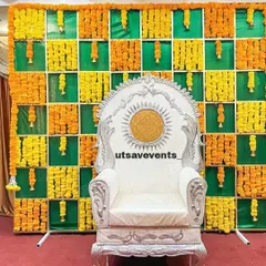A majestic silver and white throne for the mom-to-be, set against a vibrant marigold checkered backdrop. This high-back chair makes the guest of honor feel like a queen.