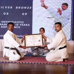A Sensei receiving his Nidan (2nd degree black belt) certificate. Our path of learning never ends, and we encourage continuous growth among our instructors and students.