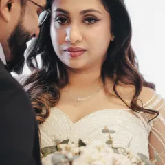 A poignant close-up of the bride, Amaya, looking at her groom. This intimate shot captures the deep love and emotion in her eyes, a key element of my cinematic style.