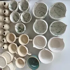 I was so excited to create a full tableware set for a new matcha cafe. This large order included hand-pinched mugs with a green splash glaze, tea pourers, and whisker stands, all designed to give an organic, unique feel to their brand.