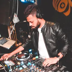 Focused and ready. Here I am at the console, lining up the next track. A good set is a story, and I'm always thinking a few beats ahead to make sure the narrative flows perfectly.