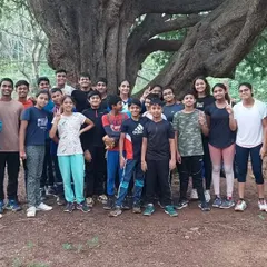 Our team isn't just confined to the pool. Here is a group shot of my swimmers and coaches during a morning jogging session in the park, building cardiovascular endurance.
