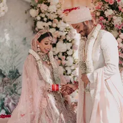 Priya and Nimlan sharing a lighthearted moment during their wedding ceremony. We focus on capturing these genuine smiles and interactions that tell the real story of the day.