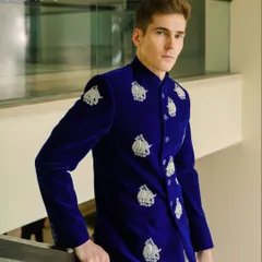 For me, clothing should tell a story. This royal blue velvet bandhgala is a perfect example, featuring hand-embroidered silver elephants that celebrate our rich Indian motifs. It's a bold, regal piece, tailored for those milestone celebrations.