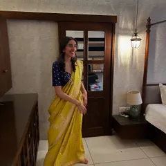The joy of reviving heirlooms is an emotion we truly cherish. Here, our co-founder Nandini wears a beautiful yellow saree, pairing it with a treasured pendant she created from her nani's kamarband.