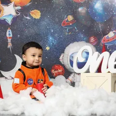 One small step for baby, one giant leap for cuteness. This astronaut-themed first birthday shoot is perfect for your little explorer, complete with a galaxy backdrop, planets, and their very own spaceship.