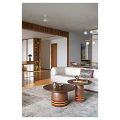 These nesting coffee tables, with their lacquered, colorful bases, are another nod to Channapatna toy craft. They are custom-designed, functional sculptures that add a playful touch to the living room.