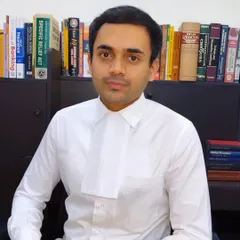 A portrait from my office. My goal is to be an approachable and reliable legal guide for my clients, ready to listen and provide clear advice.