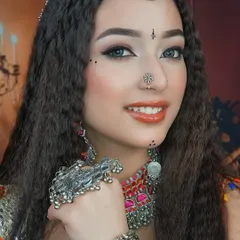 A close-up on the details of the Navratri look, showing the precise winged eyeliner, delicate bindi work, and the beautiful silver jewelry that completes the style.