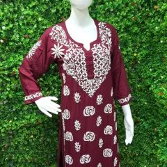 The delicate art of Lucknowi Chikankari is something I deeply admire. This maroon kurti, displayed on a mannequin, shows the beautiful, dense white thread embroidery that makes each piece a work of art. It’s crafted from soft, breathable fabric, ideal for elegant daywear.
